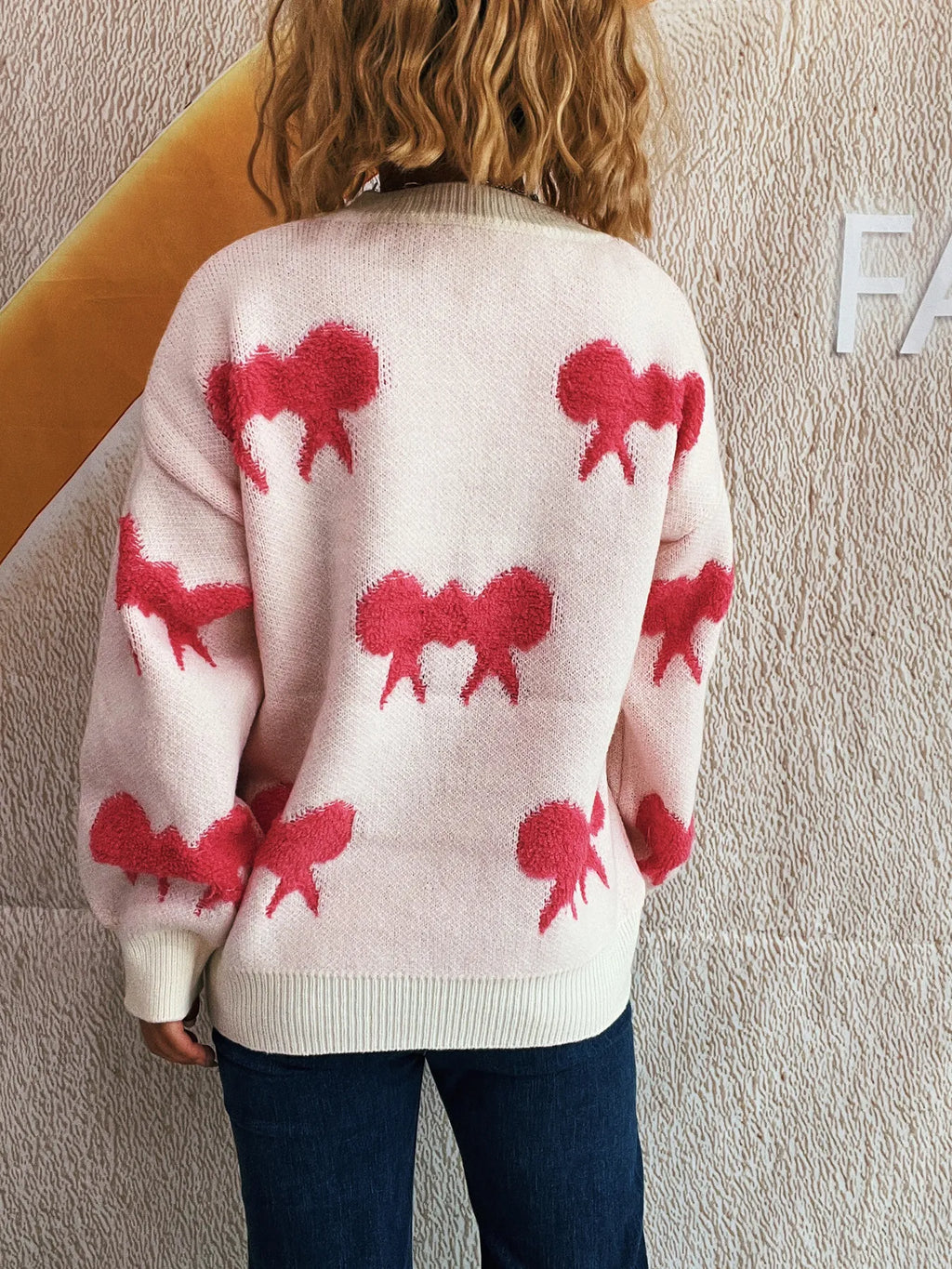 Bow Pattern Round Neck Sweater