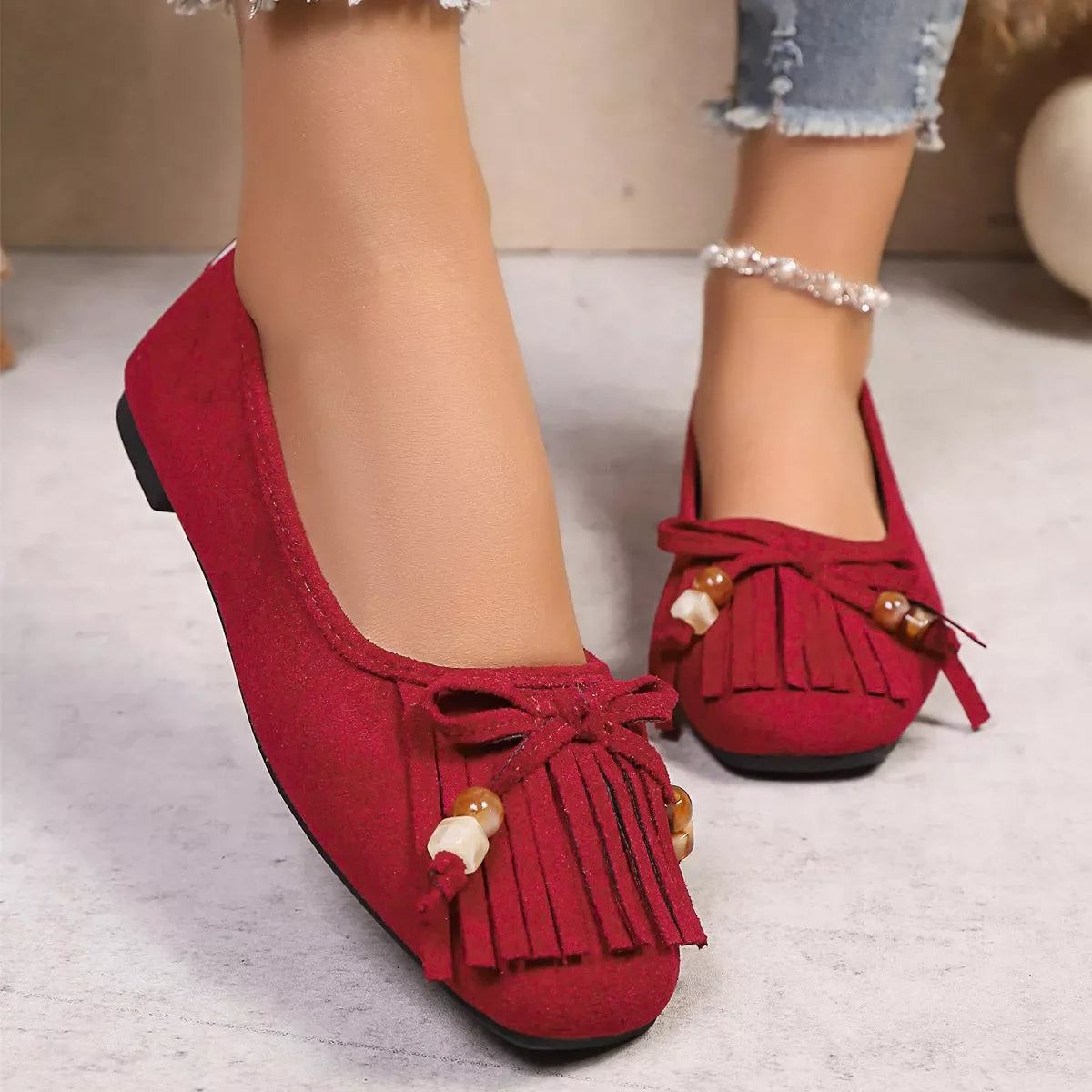 Suede Fringe Slip-Ons