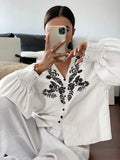 Embroidered Notched Long Sleeve Blouse