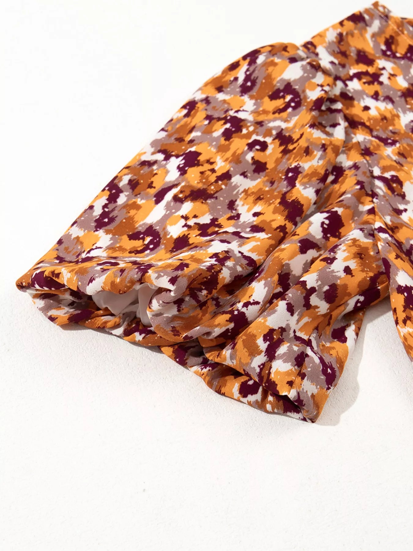 Abstract Print V Neck Smocked Babydoll Blouse